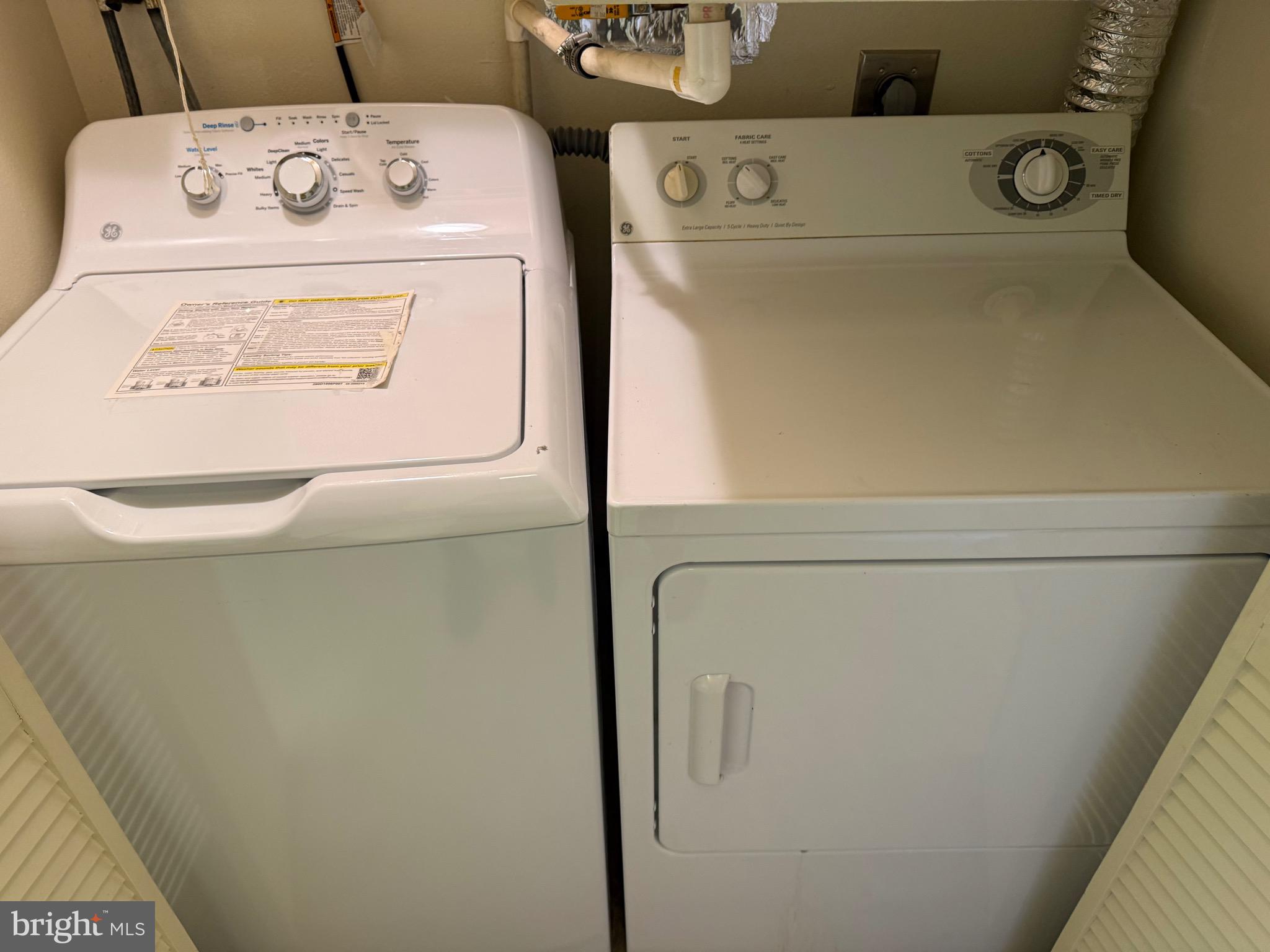 15401 Bassett Lane, Unit 452E Silver Spring, MD 20906 - Photo 19 of 31 a utility room with dryer and washer