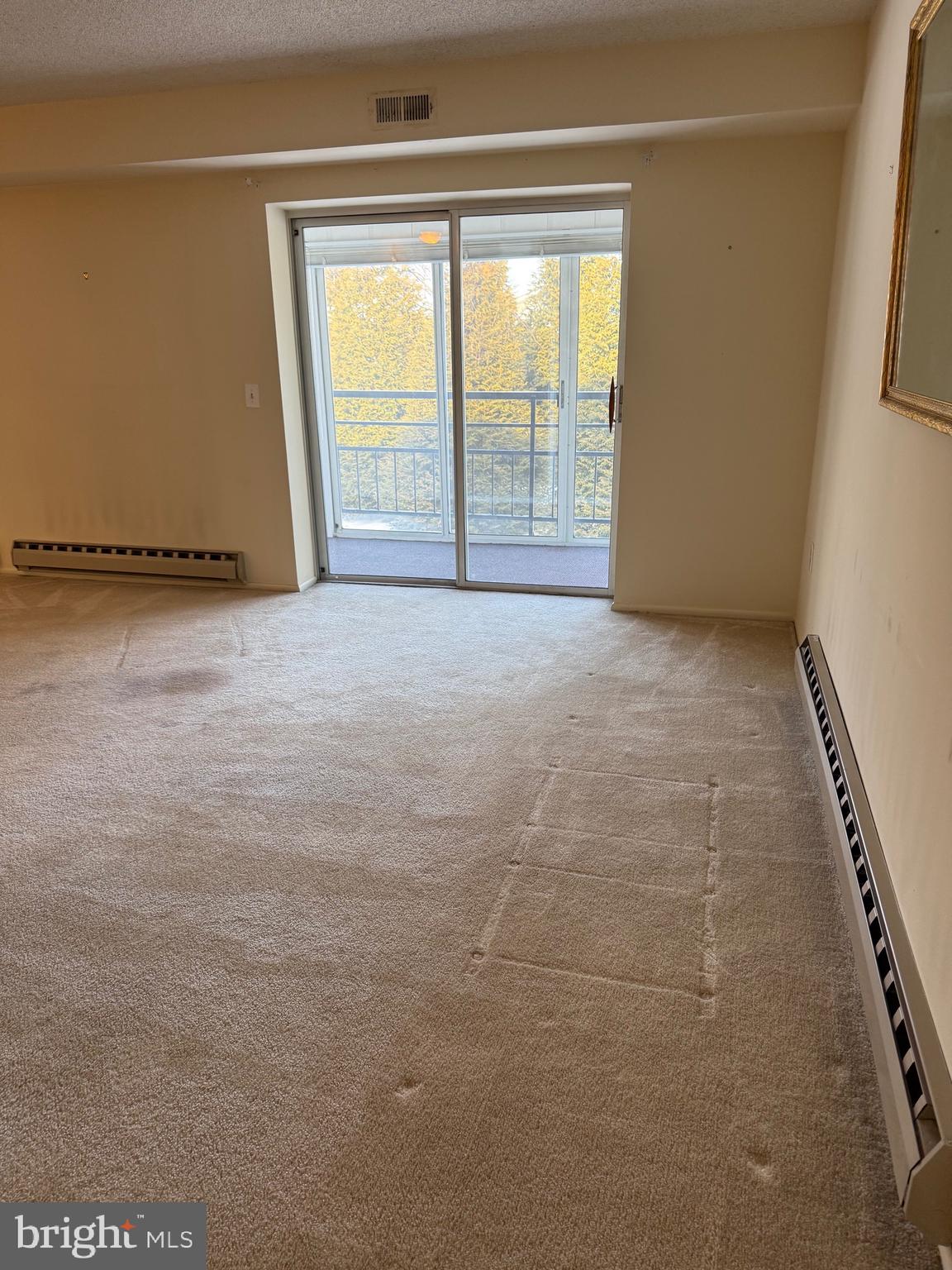 15401 Bassett Lane, Unit 452E Silver Spring, MD 20906 - Photo 21 of 31 a view of an empty room with a window