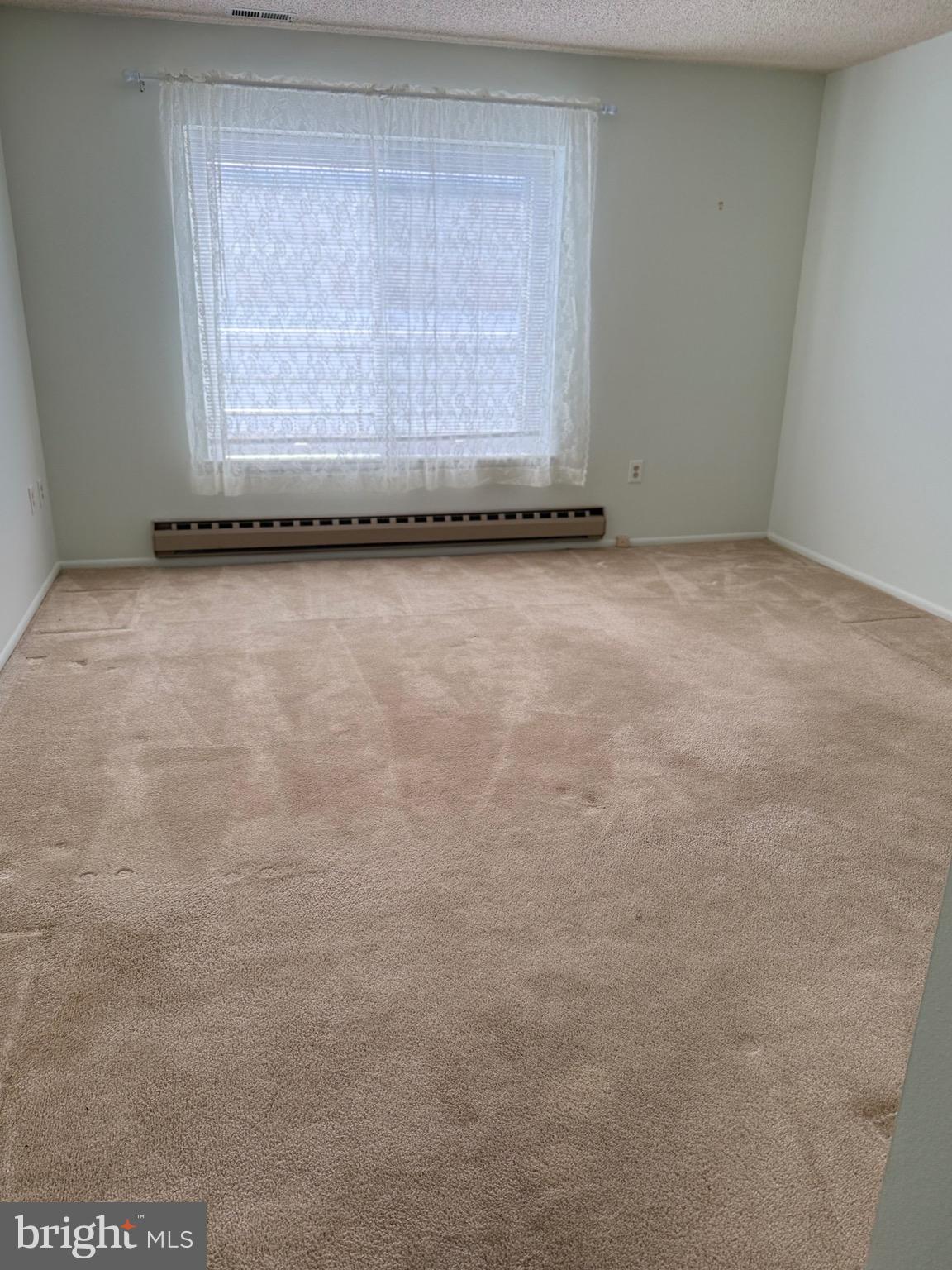 15401 Bassett Lane, Unit 452E Silver Spring, MD 20906 - Photo 24 of 31 a view of an empty room with a window