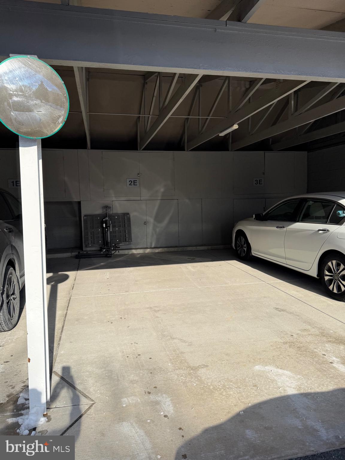 15401 Bassett Lane, Unit 452E Silver Spring, MD 20906 - Photo 30 of 31 a car parked in front of garage