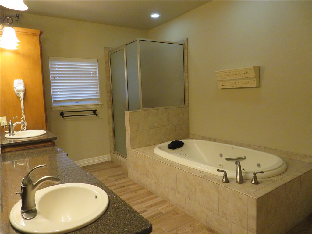 5803 South Oso Parkway Corpus Christi, TX 78414 - Photo 19 of 39 a bathroom with a sink and a mirror