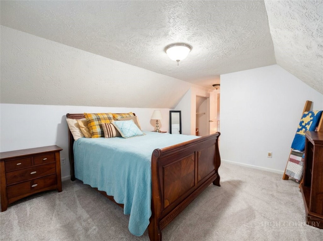 159 Easy Street Boone, NC 28607 - Photo 28 of 46 a bedroom with a bed and a dresser