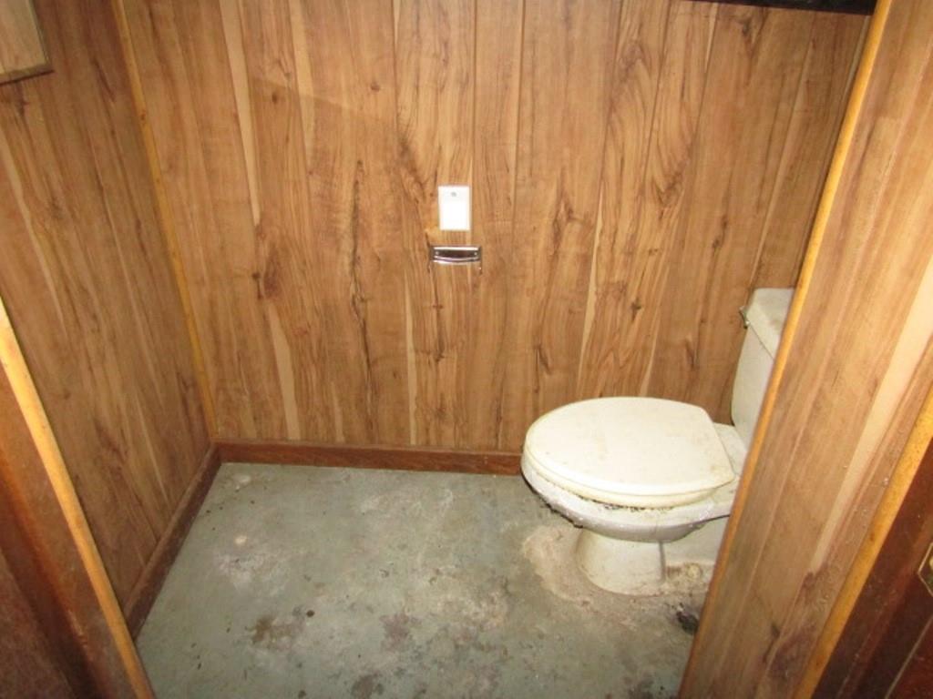 1214 1/2 3rd Street McKees Rocks, PA 15136 - Photo 28 of 28 a bathroom with a toilet and a shower curtain