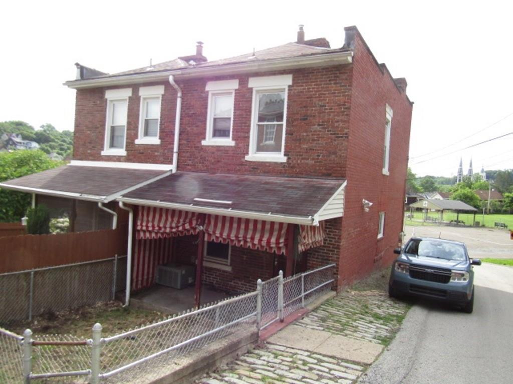 1214 1/2 3rd Street McKees Rocks, PA 15136 - Photo 3 of 28 a view of a patio with a table and chairs