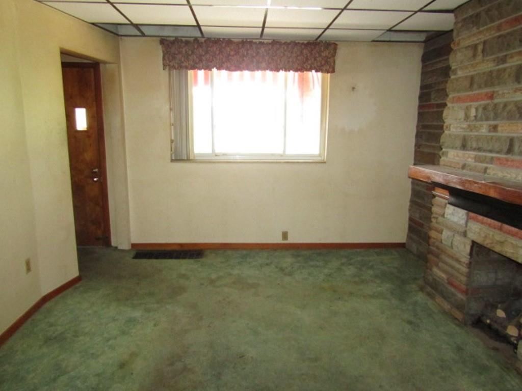 1214 1/2 3rd Street McKees Rocks, PA 15136 - Photo 6 of 28 a view of empty room with window and fireplace