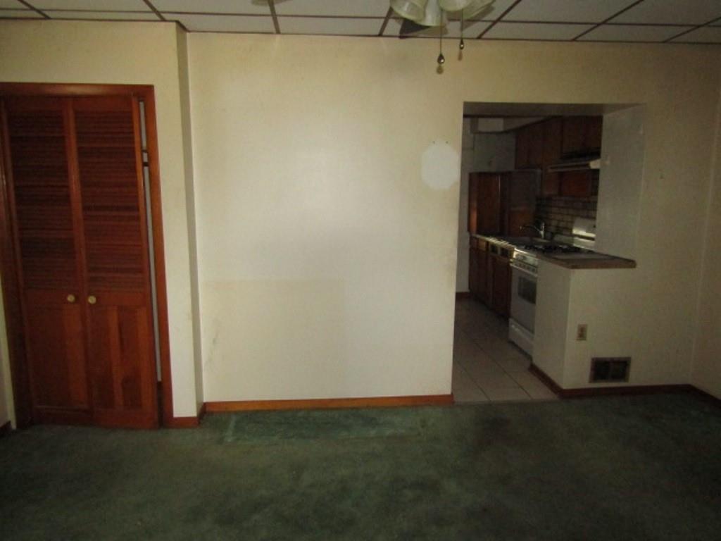 1214 1/2 3rd Street McKees Rocks, PA 15136 - Photo 7 of 28 a kitchen with a refrigerator and a stove