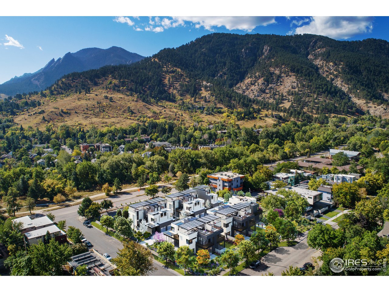 1955 3rd Street, Unit 10 Boulder, CO 80302 - Photo 2 of 15 a view of a city with mountains in the background