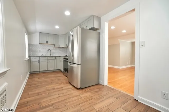 a view of kitchen with wooden floor