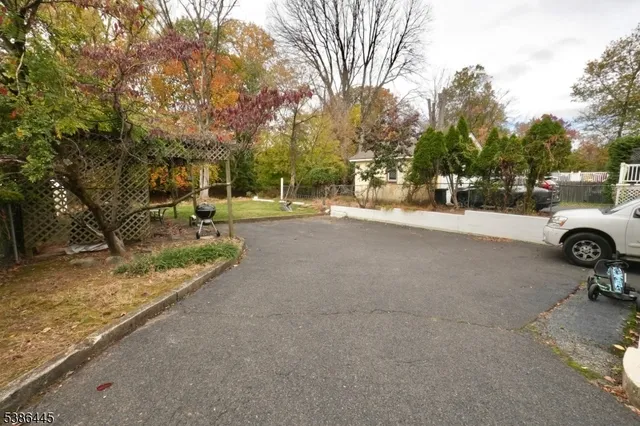 a view of a street with a parked car