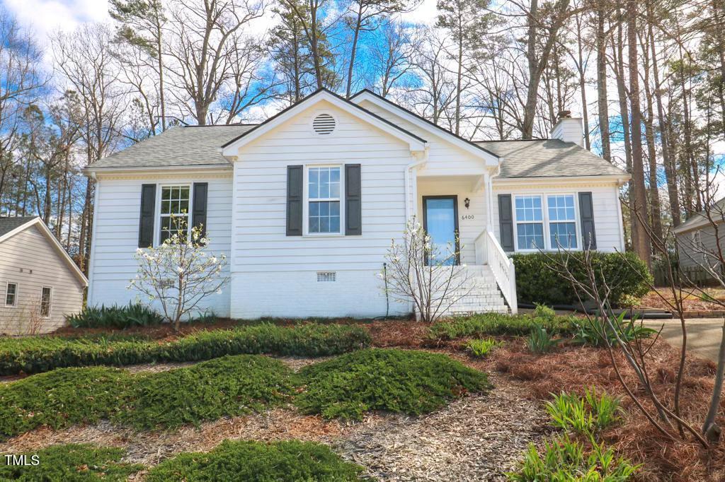 6400 Westborough Drive Raleigh, NC 27612 - Photo 1 of 15 a front view of a house with a yard