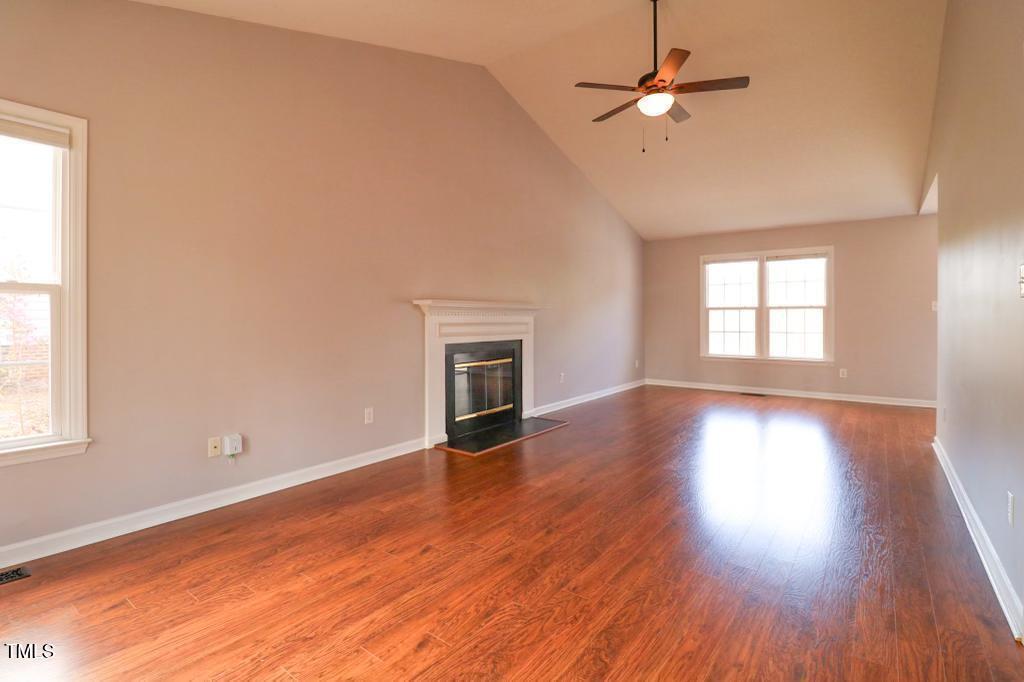6400 Westborough Drive Raleigh, NC 27612 - Photo 3 of 15 wooden floor in an empty room with a window