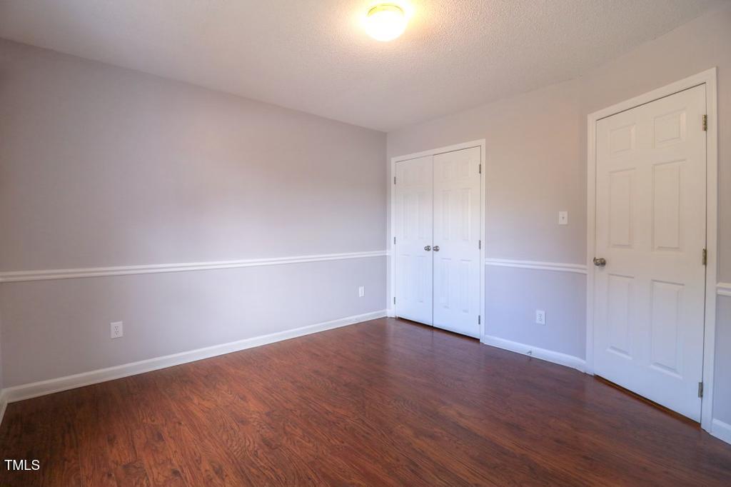 6400 Westborough Drive Raleigh, NC 27612 - Photo 8 of 15 a view of an empty room with wooden floor