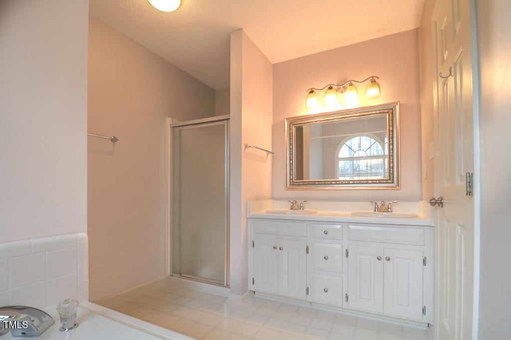 6400 Westborough Drive Raleigh, NC 27612 - Photo 10 of 15 a bathroom with a sink and a mirror