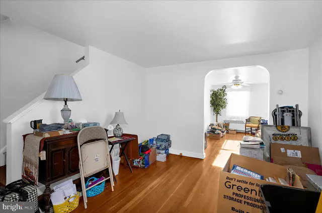 a view of a workspace with furniture and a flat screen tv