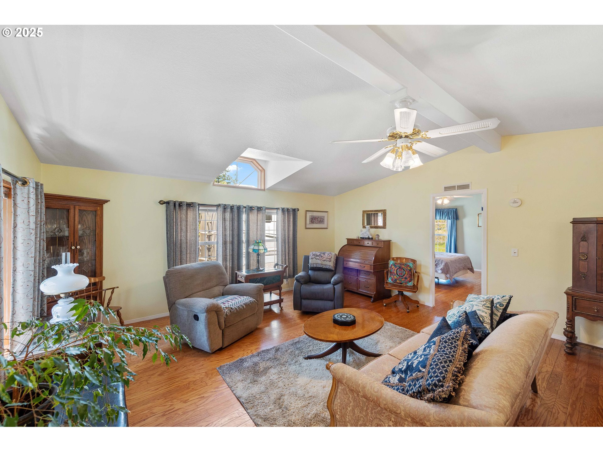 1615 Kristi Loop Lakeside, OR 97449 - Photo 15 of 38 a living room with furniture and a large window
