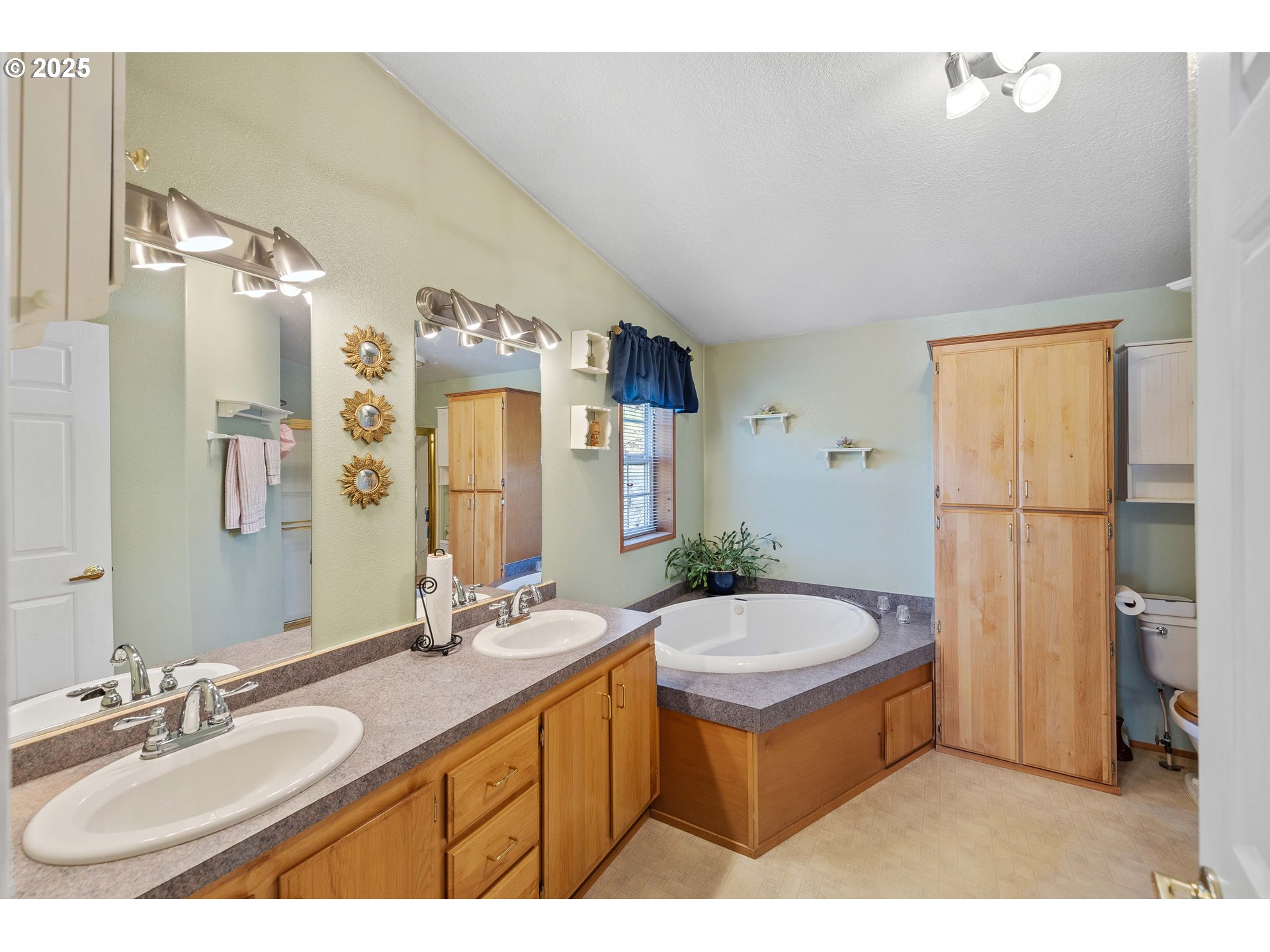 1615 Kristi Loop Lakeside, OR 97449 - Photo 18 of 38 a bathroom with a granite countertop sink and a mirror