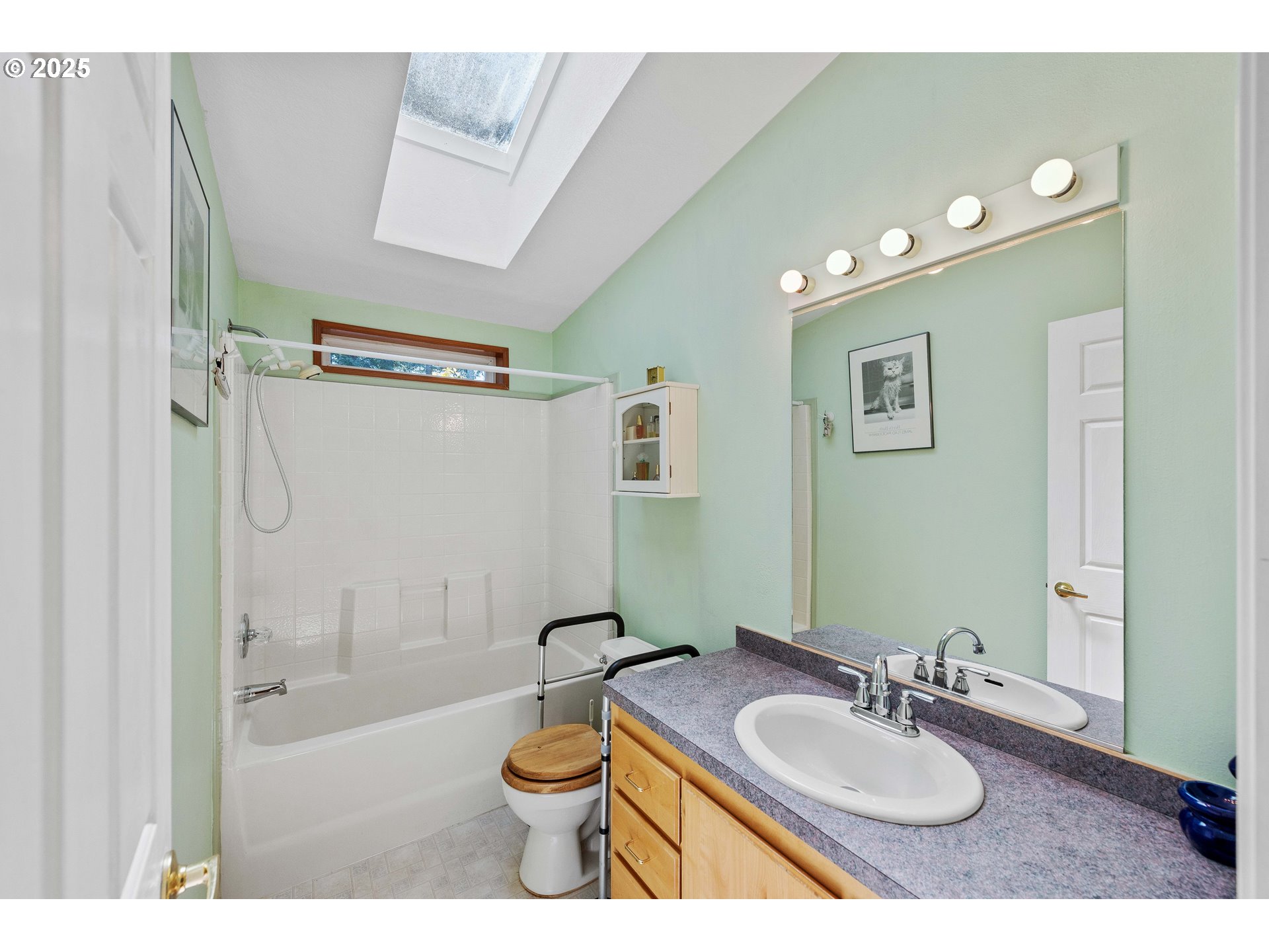 1615 Kristi Loop Lakeside, OR 97449 - Photo 22 of 38 a bathroom with a granite countertop sink mirror vanity and toilet