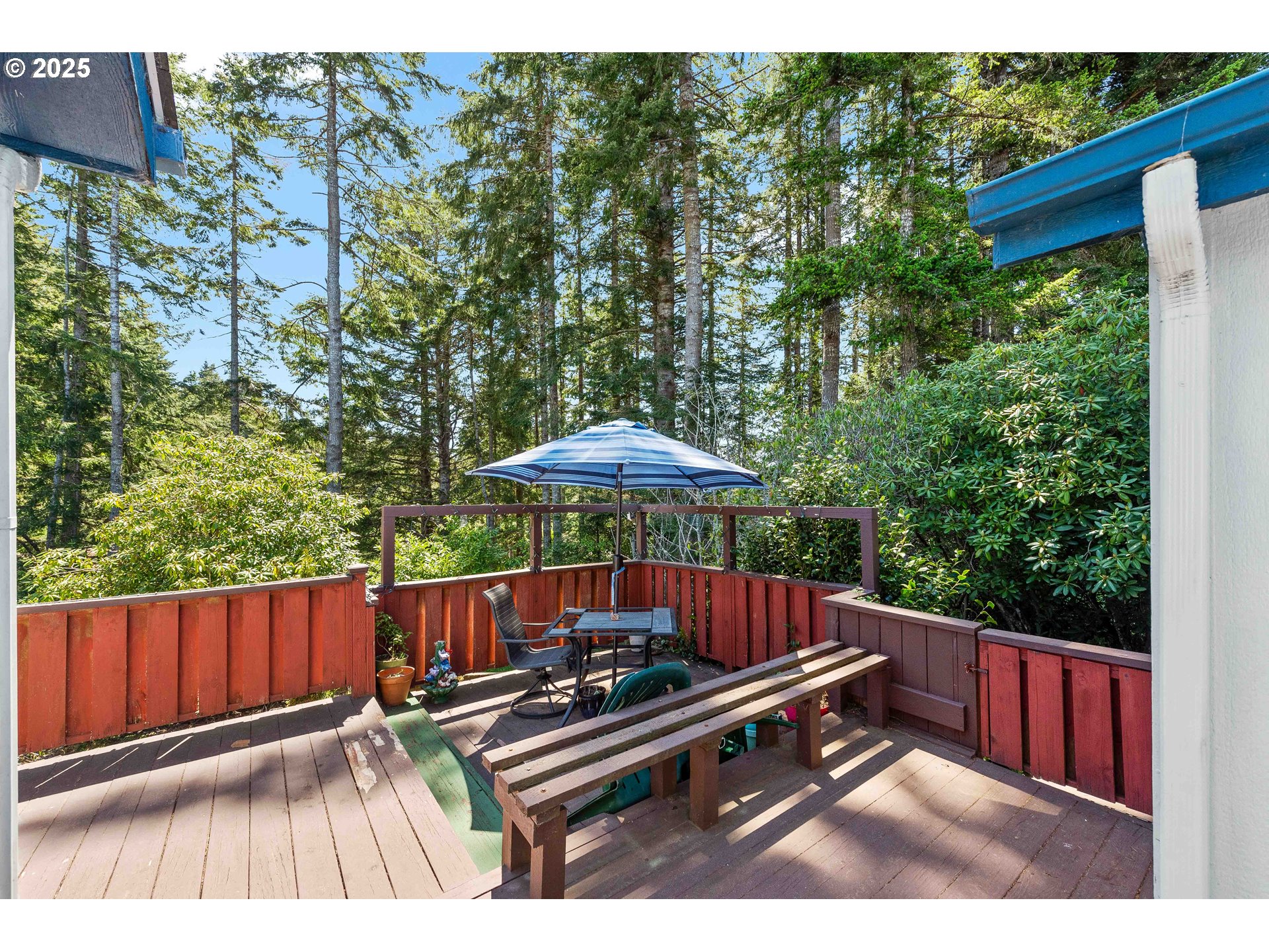 1615 Kristi Loop Lakeside, OR 97449 - Photo 29 of 38 a view of backyard with deck and outdoor seating