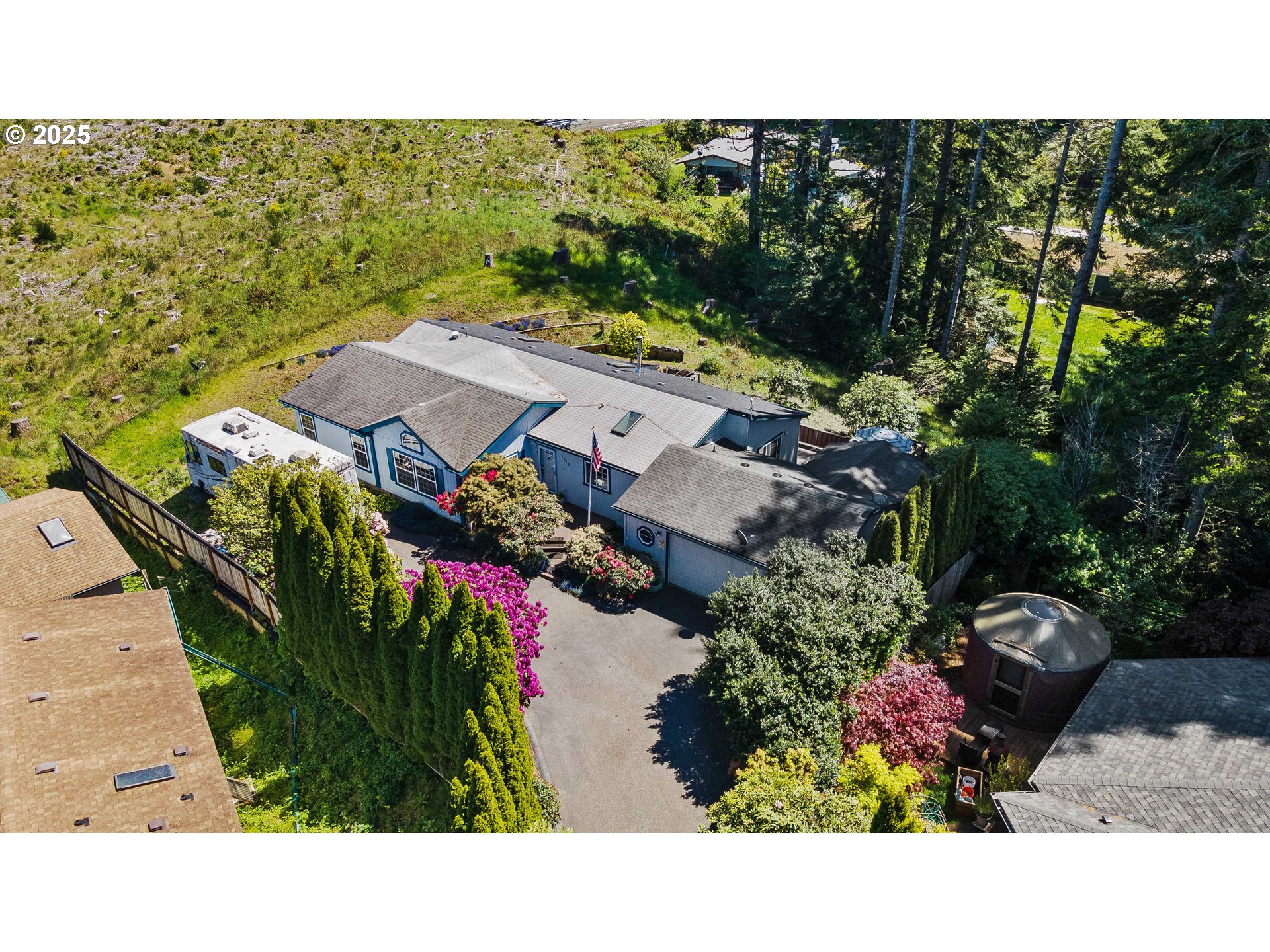 1615 Kristi Loop Lakeside, OR 97449 - Photo 31 of 38 a view of a house with a garden