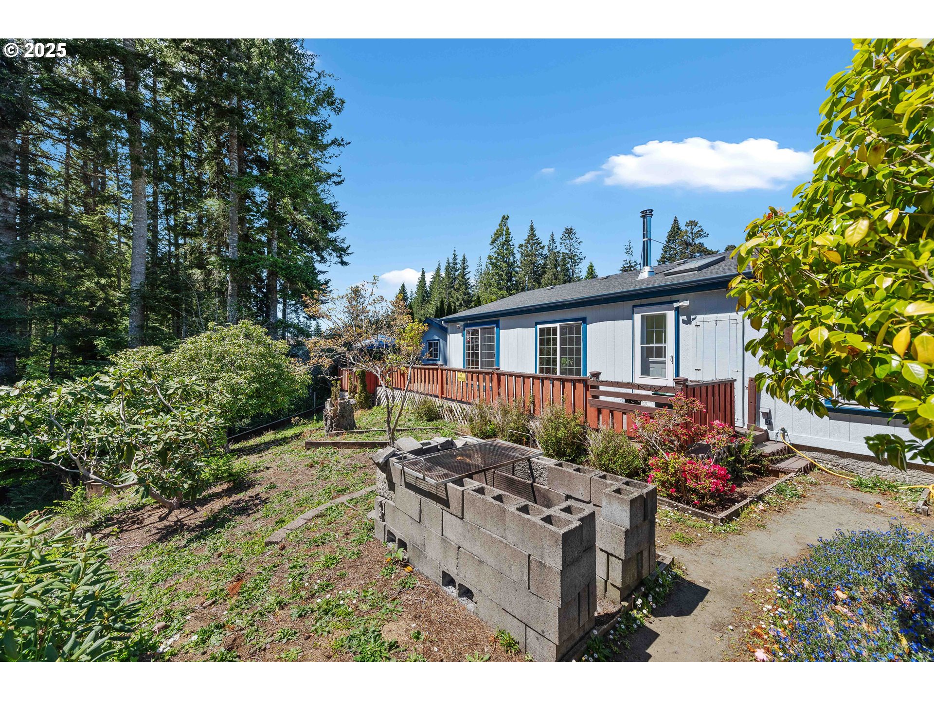 1615 Kristi Loop Lakeside, OR 97449 - Photo 34 of 38 a view of backyard of house and outdoor seating