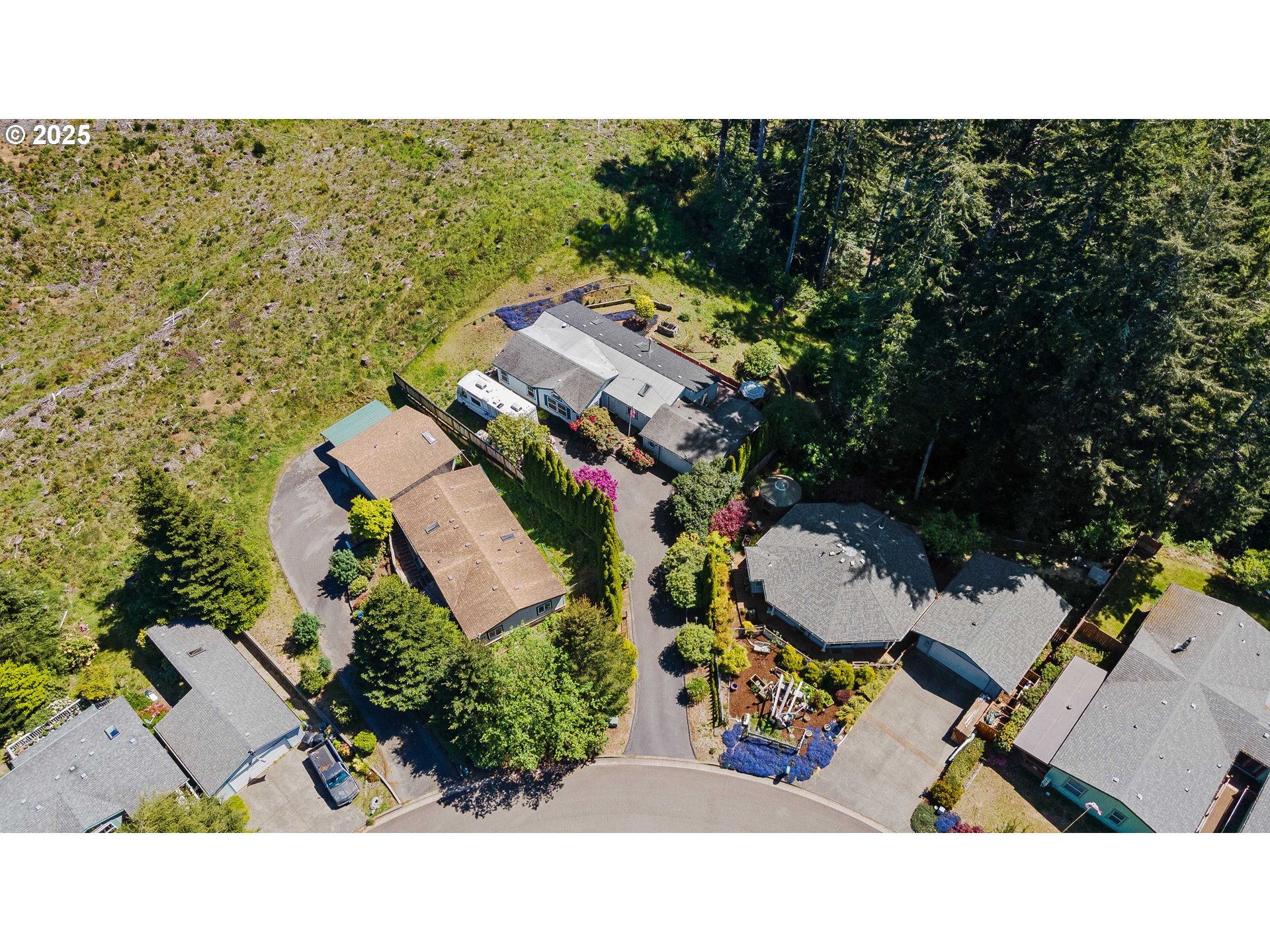 1615 Kristi Loop Lakeside, OR 97449 - Photo 38 of 38 an aerial view of a house with a yard
