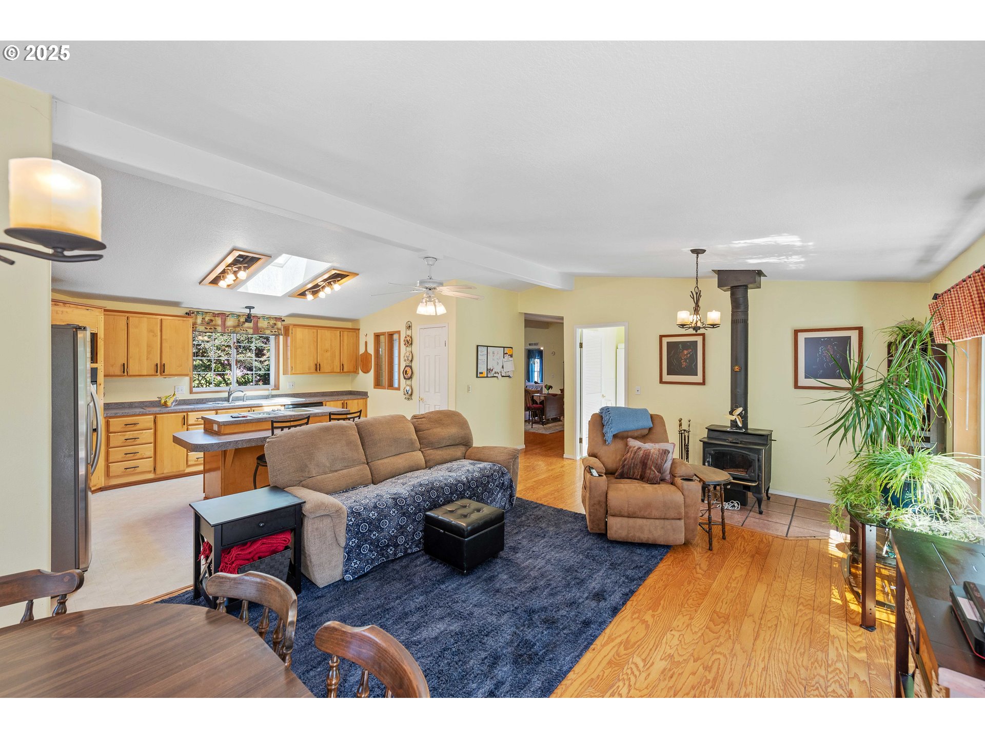 1615 Kristi Loop Lakeside, OR 97449 - Photo 10 of 38 a living room with furniture and a flat screen tv