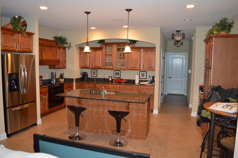812 Little Springs Road Clarksville, TN 37040 - Photo 5 of 19 a kitchen with a refrigerator a sink and a dining table