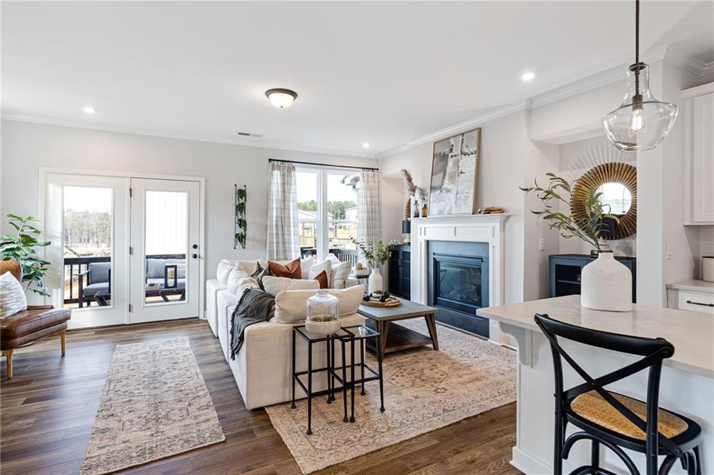 821 Cameron Trail Acworth, GA 30102 - Photo 19 of 30 a living room with fireplace furniture and a wooden floor