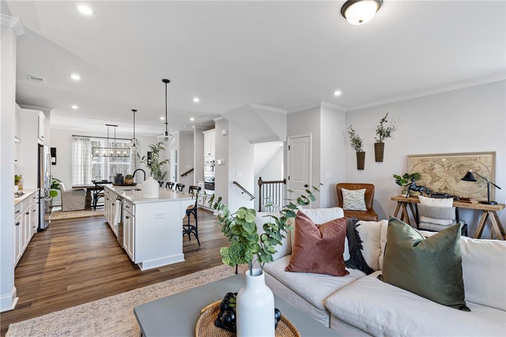 821 Cameron Trail Acworth, GA 30102 - Photo 2 of 30 a living room with furniture kitchen view and a chandelier