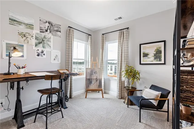 a view of a livingroom with furniture and a window