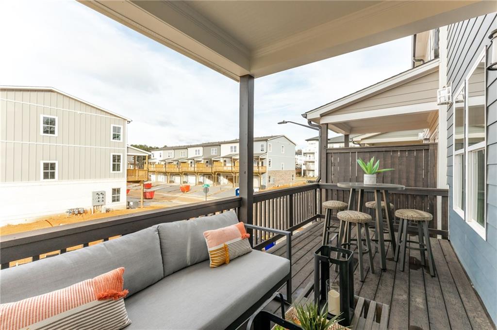821 Cameron Trail Acworth, GA 30102 - Photo 29 of 30 a balcony with furniture and view of kitchen