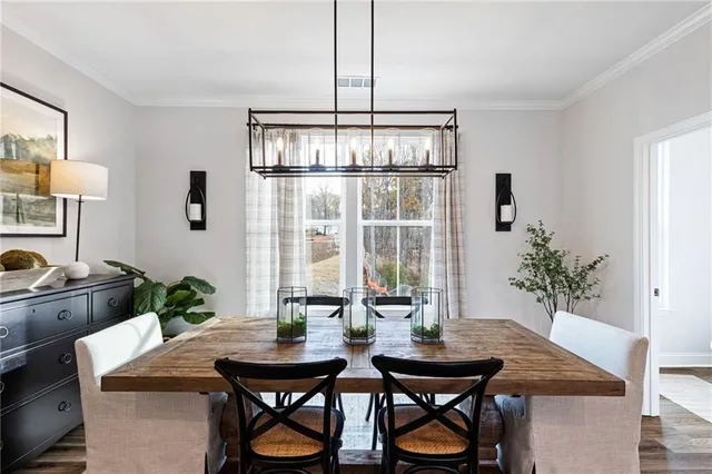 a view of a dining room with furniture and window