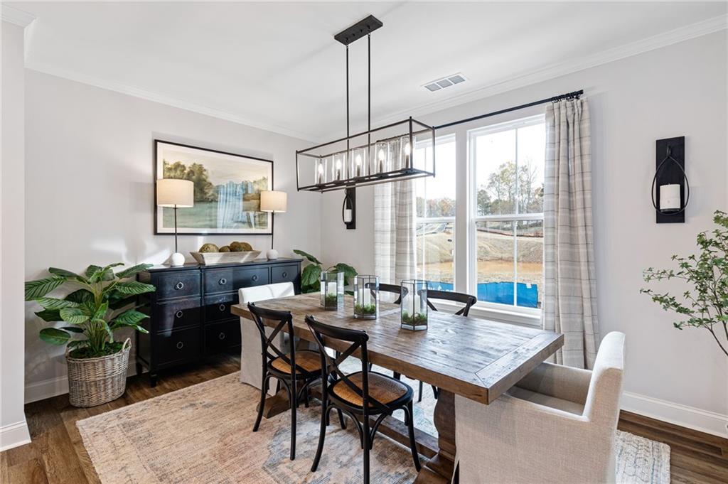 821 Cameron Trail Acworth, GA 30102 - Photo 4 of 30 a view of a dining room with furniture window and wooden floor