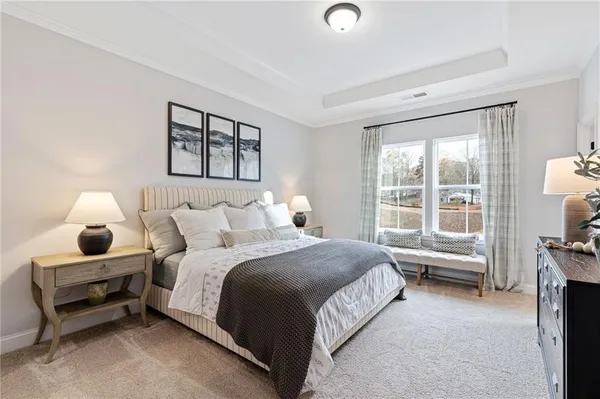 a spacious bedroom with a bed and a window