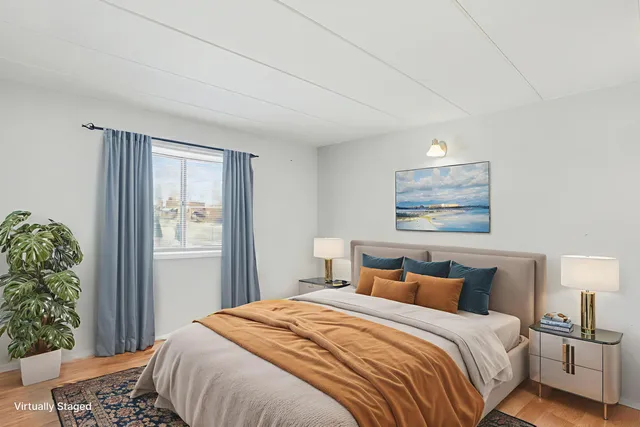 a bedroom with bed and a window