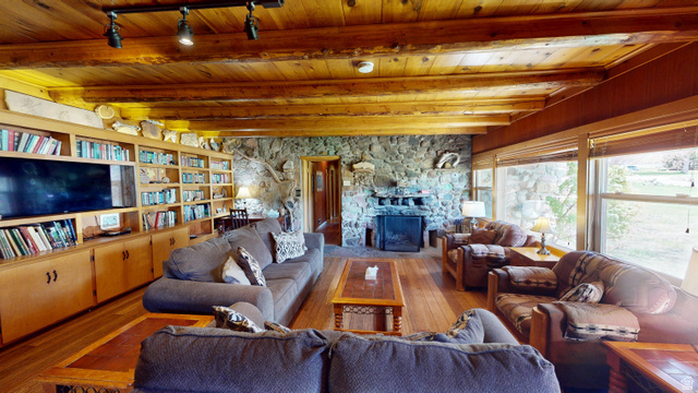 315 Abbey Road Moab, UT 84532 - Photo 40 of 46 Living room featuring a fireplace, hardwood / wood-style flooring, a wood ceiling with exposed beams, and rail lighting