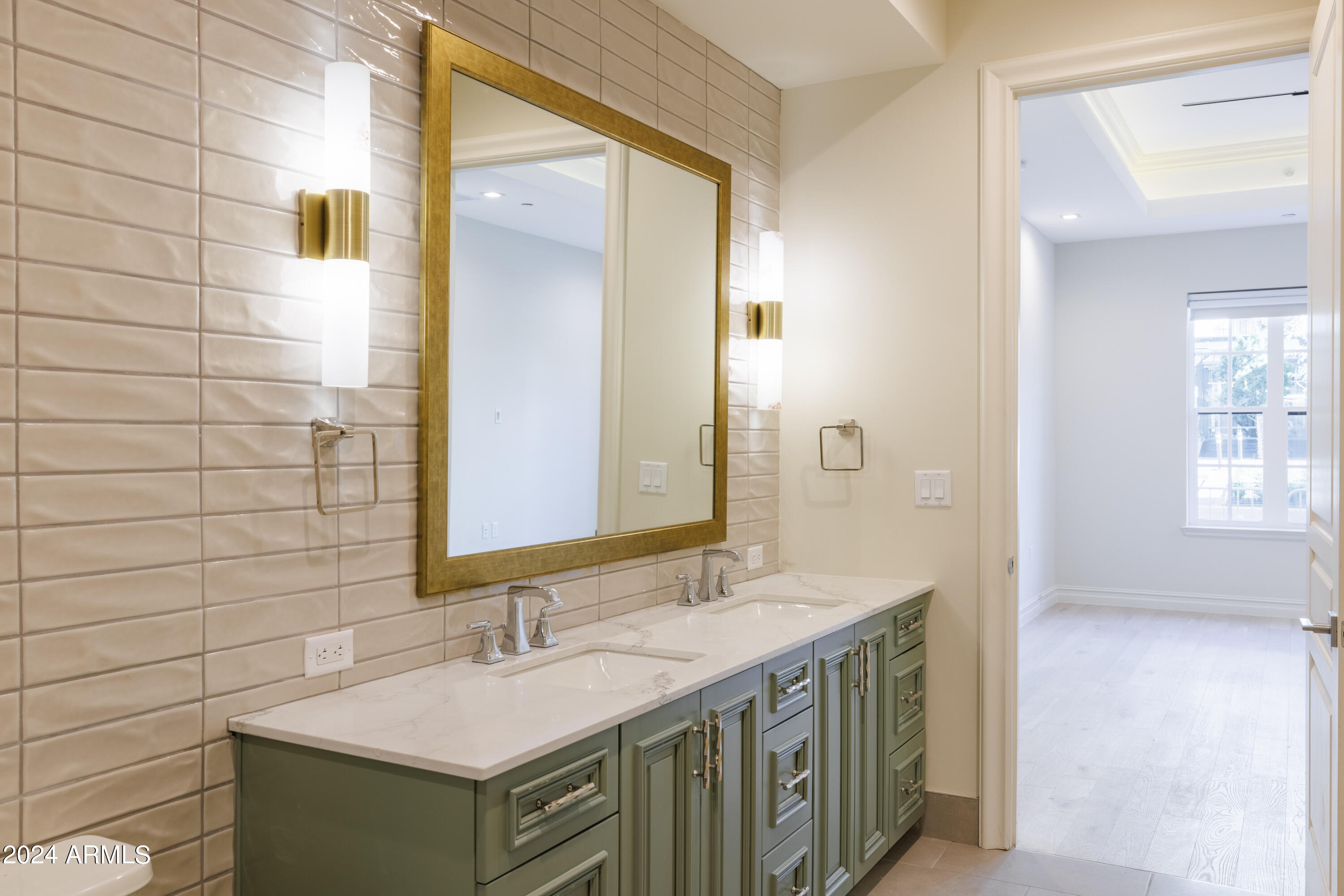4240 East Camelback Road, Unit 508 Phoenix, AZ 85018 - Photo 12 of 27 a bathroom with a granite countertop sink and a mirror