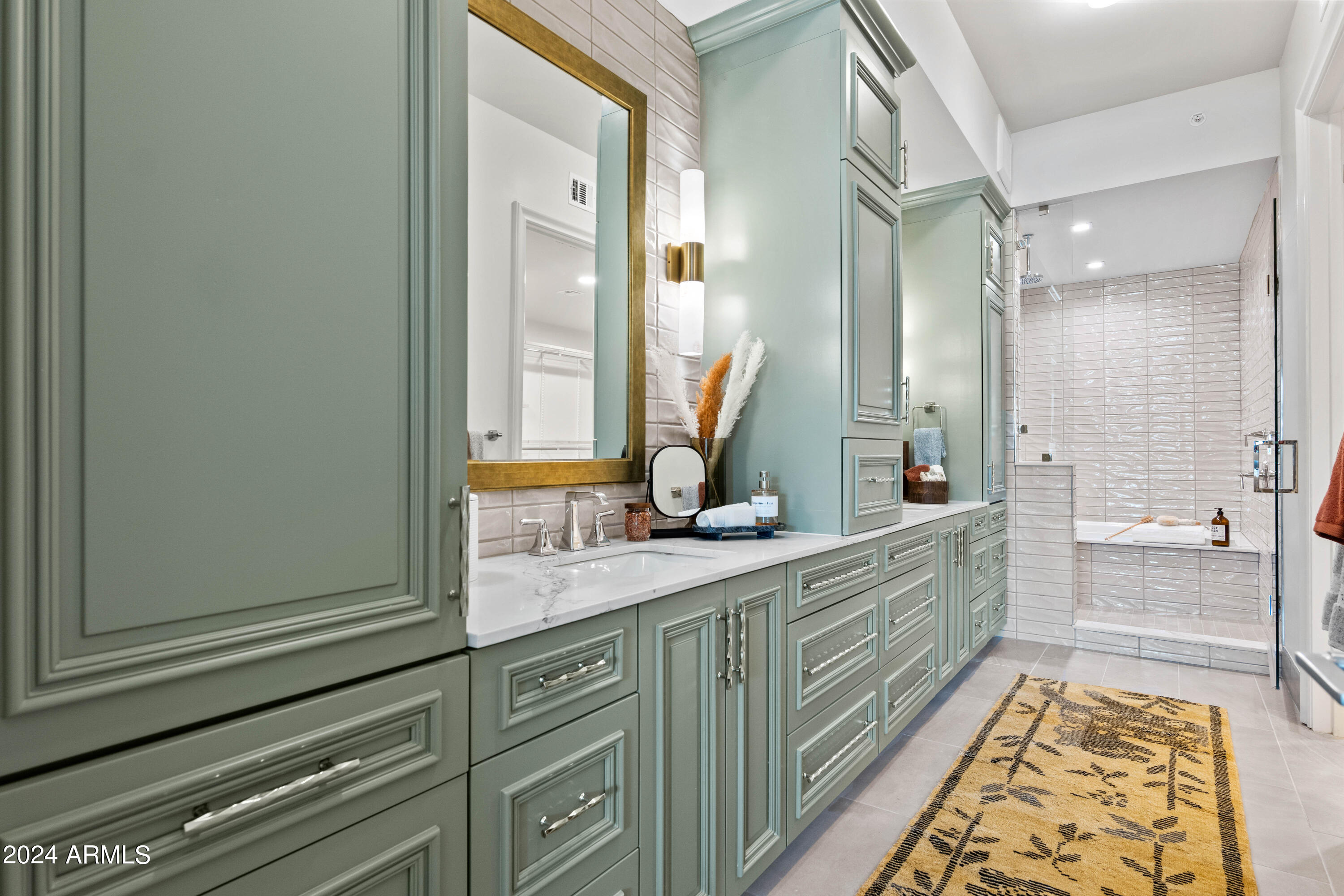4240 East Camelback Road, Unit 508 Phoenix, AZ 85018 - Photo 2 of 27 a bathroom with a double vanity sink mirror and bathtub