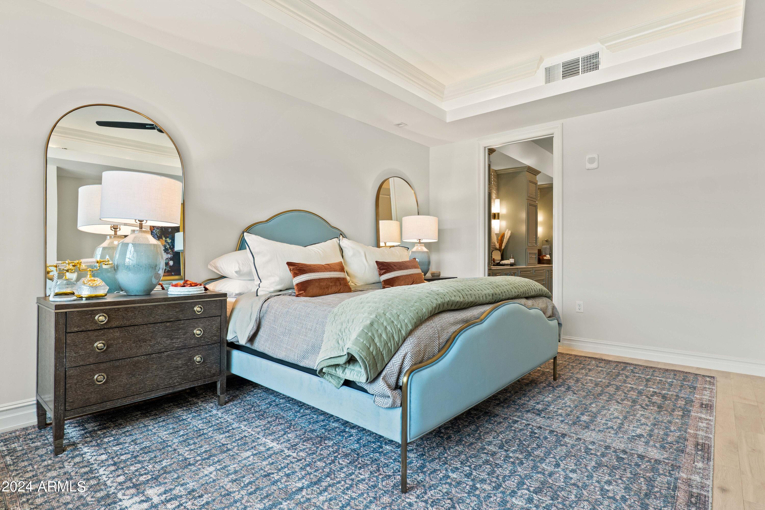 4240 East Camelback Road, Unit 508 Phoenix, AZ 85018 - Photo 3 of 27 a bedroom with a bed and a dresser