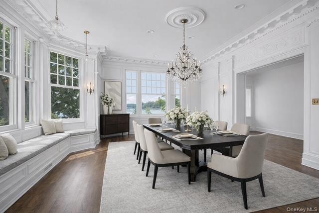 158 East Shore Road Huntington Bay, NY 11743 - Photo 13 of 50 a view of a dining room with furniture and chandelier
