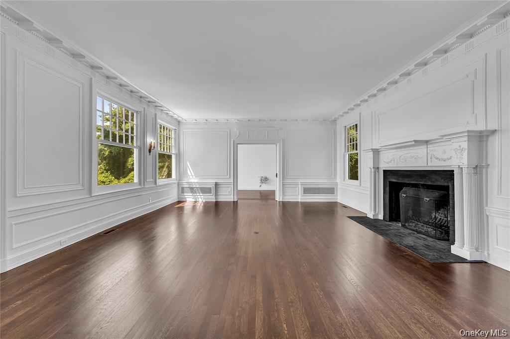 158 East Shore Road Huntington Bay, NY 11743 - Photo 17 of 50 a view of an empty room with window and wooden floor