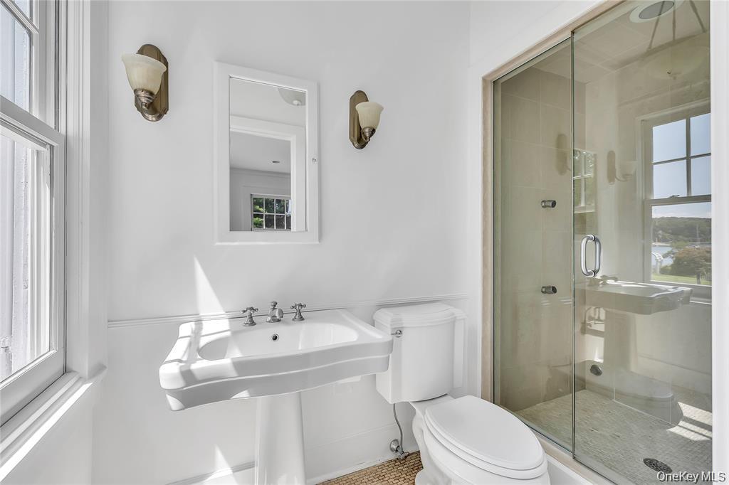 158 East Shore Road Huntington Bay, NY 11743 - Photo 24 of 50 a bathroom with a sink toilet and shower