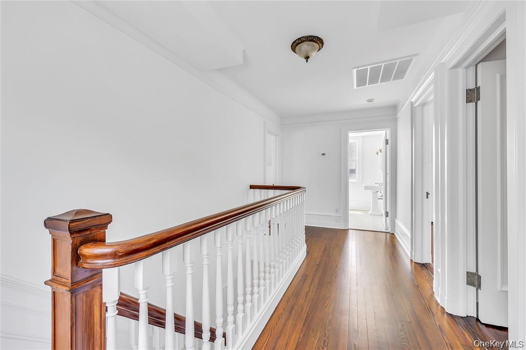 158 East Shore Road Huntington Bay, NY 11743 - Photo 32 of 50 a view of a hallway with wooden floor