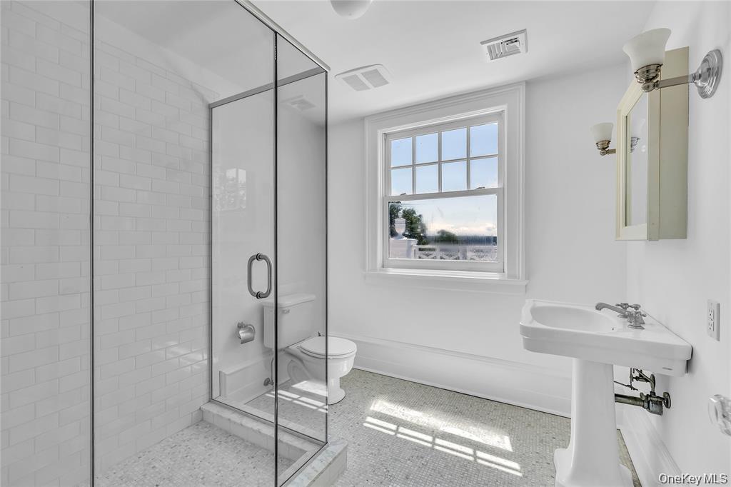 158 East Shore Road Huntington Bay, NY 11743 - Photo 35 of 50 a bathroom with a shower and a sink