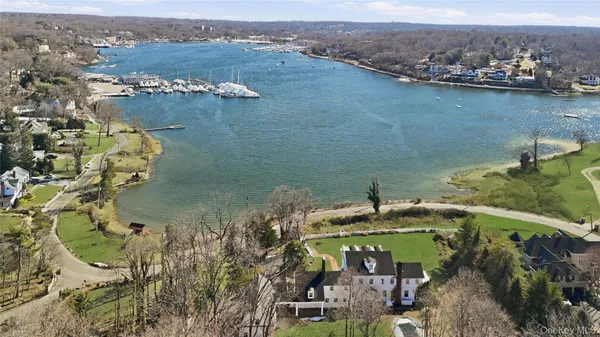 an aerial view of a house with a lake view