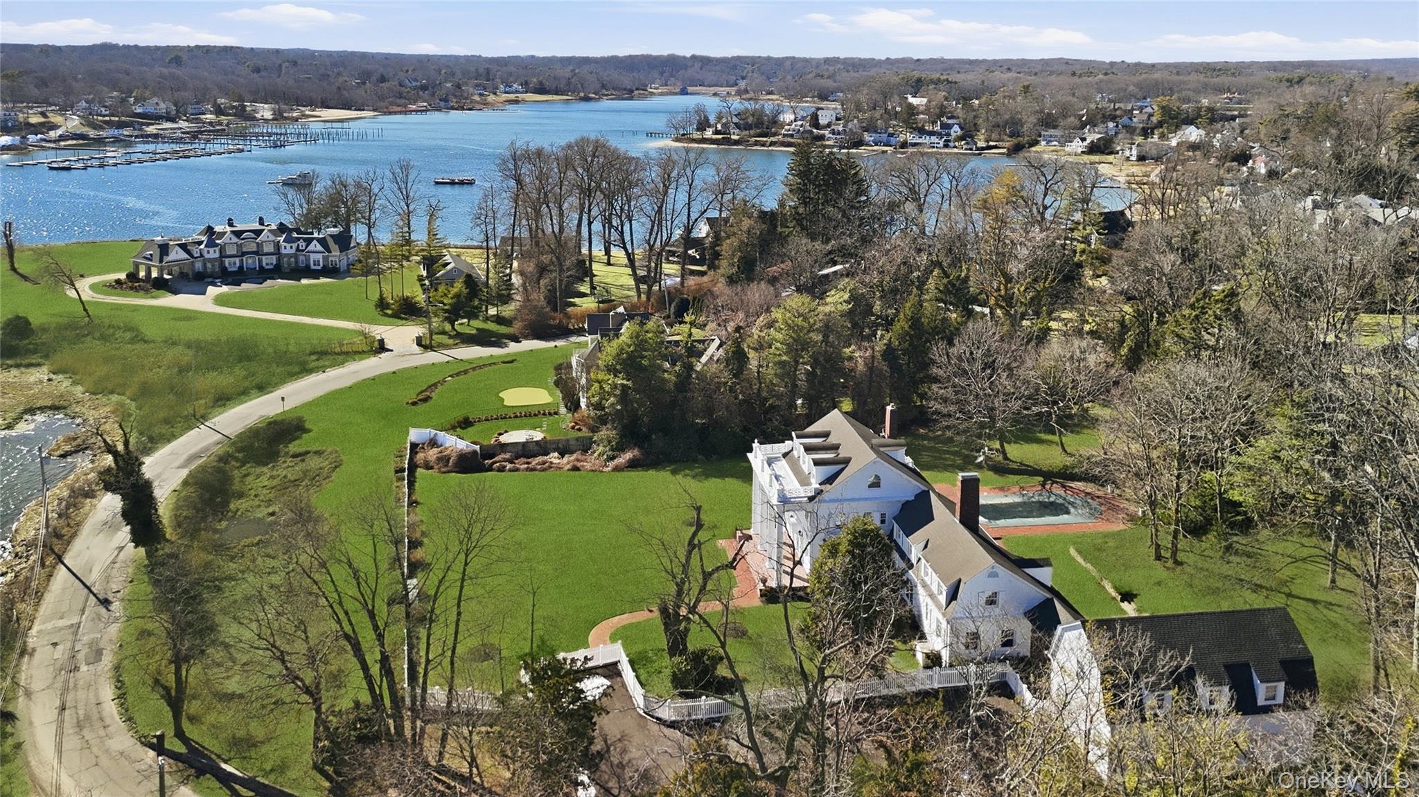 158 East Shore Road Huntington Bay, NY 11743 - Photo 46 of 50 an aerial view of a house with outdoor space and a lake view