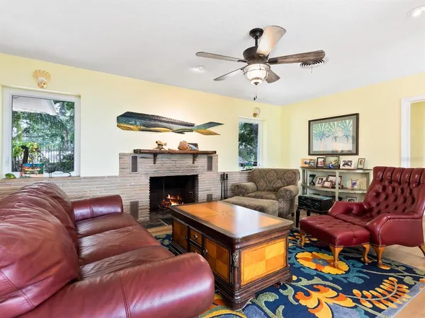 a bedroom with furniture and a fireplace