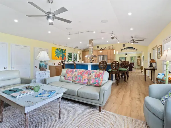 a kitchen with a sink appliances and cabinets