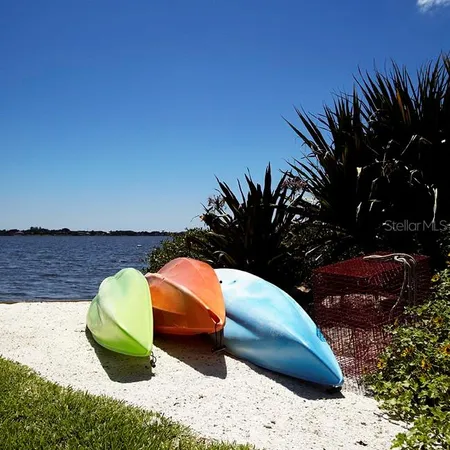 an outdoor space with swimming pool and furniture