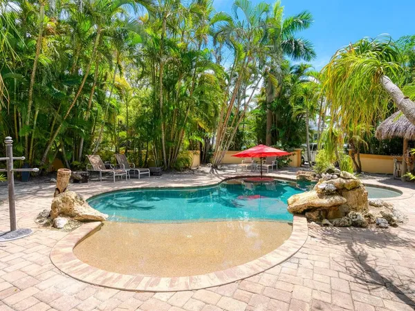 a view of a garage with a tree